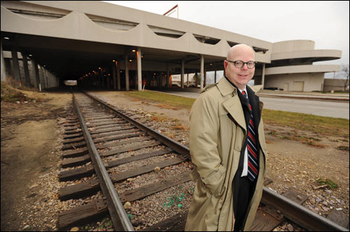 Axley Brynelson attorney Peter J. Conrad stands on the train tracks outside Monona Terrace in Madison. Conrad is a member of the firm’s Rail & Transportation Team, which was formed in anticipation of the high-speed rail project from Milwaukee to Madison coming to fruition. WLJ photo by Kevin Harnack