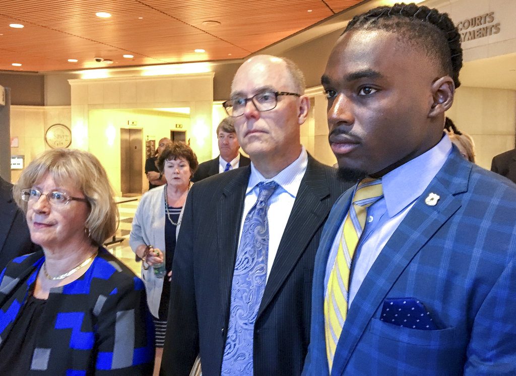 University of Wisconsin wide receiver Quintez Cephus, right, with his attorneys Kathleen Stalling, left, and Stephen Meyer after appearing in court on Thursday, Aug. 23, 2018 in Madison, Wis. Prosecutors charged Cephus on Monday with second- and third-degree sexual assault, which are both felonies. The second-degree charge carries a maximum sentence of 40 years in prison. (Ed Treleven/Wisconsin State Journal via AP)