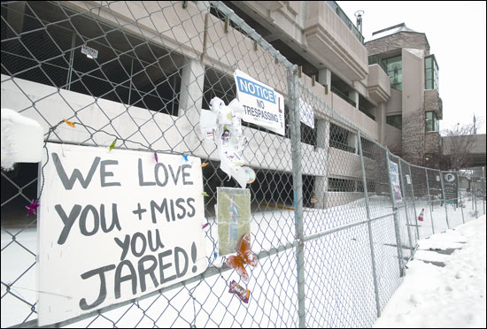 A memorial honoring Jared Kellner hangs Jan. 24 from the chain link fence that stands around the O'Donnell Park parking garage in Milwaukee. The structure has been closed since a portion of concrete façade fell from the building, killing the 15-year-old last June. A wrongful death lawsuit filed by his family will test Wisconsin's builders' statute of repose. WLJ photo by Kevin Hanack