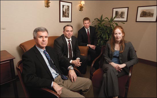 Quarles & Brady lawyers from left, Dave Cross, Ray Jamieson, Patrick Murphy and Johanna Wilbert gather at the firm's Milwaukee office Wednesday, Jan 12. The team was responsible for a $25 million settlement in 2010. (WLJ photo by Kevin Harnack)