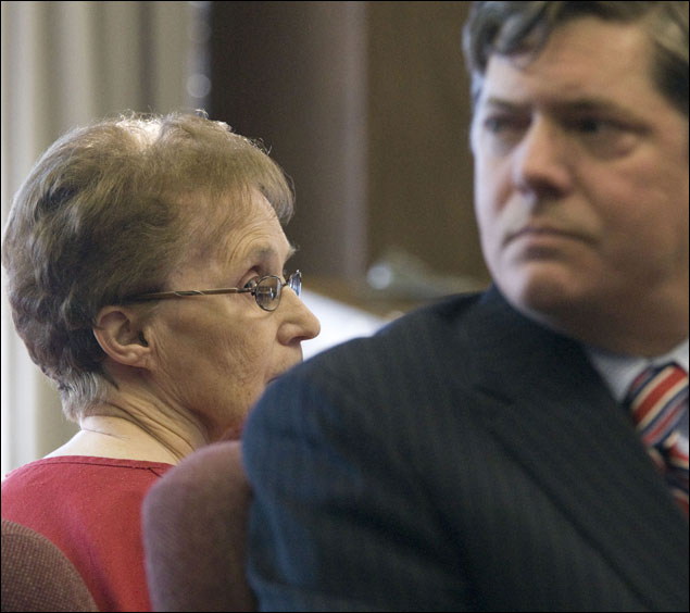 Ruby Klokow, 74, glances at her attorney, Kirk Obear, during her preliminary hearing Wednesday in Sheboygan.
