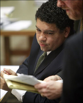 Dane County District Attorney Ismael Ozanne consults with a colleague during a hearing in Dane County Court in Madison on Friday. (AP Photo/Pool, Mark Hoffman)