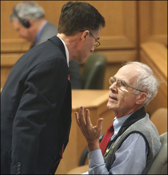 Wisconsin Secretary of State Douglas La Follette (right) talks with his attorney, Roger Sage, as he leaves court March 18 during a hearing in Dane County Court in Madison. (AP Photo/Pool, Mark Hoffman)