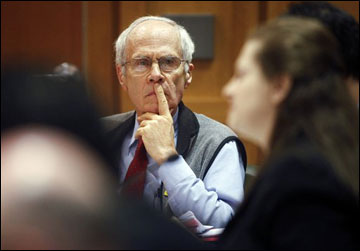 Secretary of State Doug La Follette listens to Assistant Attorney General Maria Lazar make her opening arguments at a hearing in front of Dane County Circuit Judge Maryann Sumi at the Dane County Courthouse in Madison on Tuesday. With Republican Gov. Scott Walker's administration insisting a new law eliminating most of state workers' collective bargaining rights had gone into effect and other state and municipal leaders disputing that, many were looking to today's court hearing for some kind of clarity. (AP Photo/Michael P. King, Pool)