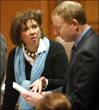 Peggy Lautenschlager, attorney for the petitioners, and state Assistant Attorney General Steve Means talk over paperwork before a hearing at the Dane County Courthouse in Madison on Tuesday. The hearing revolved around a petition for a temporary injunction to require the Wisconsin Department of Administration to reopen the Capitol to the public. Judge John C. Albert ordered Wisconsin officials to open the Capitol to all members of the public during normal business hours. (AP Photo/M.P. King, Pool)