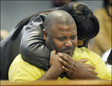 Dianthe Smith hugs Damian Dolley, the father of Damian Tubbs-Dolley who was shot and killed on Oct. 19, 2006, in Racine during a sentencing hearing for her son, Jerry Henderson, on Friday in Racine County Circuit Court. Henderson was sentenced to 20 years prison and five years extended supervision for the fatal shooting. He had pleaded guilty to second-degree reckless homicide while armed. Smith apologized to Tubbs-Dolley’s family, and said her son wasn’t raised that way. (AP Photo/Journal Times, Gregory Shaver)