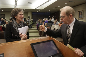 Justice David Prosser gives a thumbs-up to Assistant Attorney General JoAnne Kloppenburg before their debate for the Wisconsin Supreme Court at the Marquette University Law School in Milwaukee on Monday. (AP Photo/Milwaukee Journal-Sentinel, Benny Sieu)