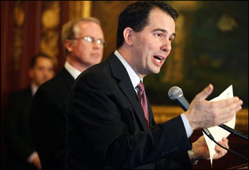 Gov. Scott Walker addresses the media Monday in Madison. Walker's budget proposal includes public financing for Supreme Court campaigns. (AP-Photo/Wisconsin State Journal, John Hart)