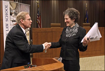 Justice David Prosser shakes hands with Assistant Attorney General JoAnne Kloppenburg March 21 after their debate for the Wisconsin Supreme Court at the Marquette University Law School in Milwaukee. (AP Photo/Milwaukee Journal-Sentinel, Benny Sieu)