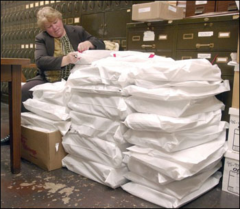 Donna Deuster, the assistant city clerk in Racine, verifies security tags on sealed bags of ballots cast in the County Clerk's office in the Racine County Courthouse on April 6. (AP Photo/Journal Times, Mark Hertzberg)