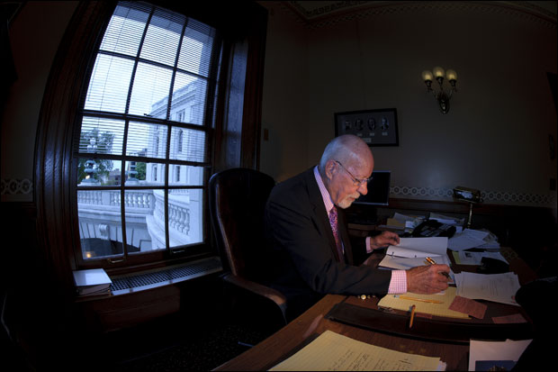 Sen. Fred Risser looks over documents at his desk at the state Capitol. Risser joined the Legislature in the 1950s, an era when most lawmakers maintained full-time careers outside the Capitol. (Staff photo by Kevin Harnack)