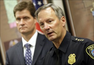 Milwaukee police Chief Ed Flynn, right, addressed the media on the charges against four Milwaukee police officers accused of illegally strip searching and sexually assaulting nearly a dozen people over a two-year span, Tuesday, Oct. 9, 2012, in Milwaukee. Milwaukee County District Attorney John Chisholm listens at left. (AP Photo/Milwaukee Journal-Sentinel, Mike De Sisti)