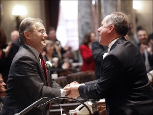 Incoming state Assembly Speaker Robin Vos, right, R-Rochester is congratulated by by Minority Leader Peter Barca, D-Kenosha, during the opening session of the chamber Monday, Jan. 7, 2013, in Madison, Wis. (AP Photo/Wisconsin State Journal, John Hart)