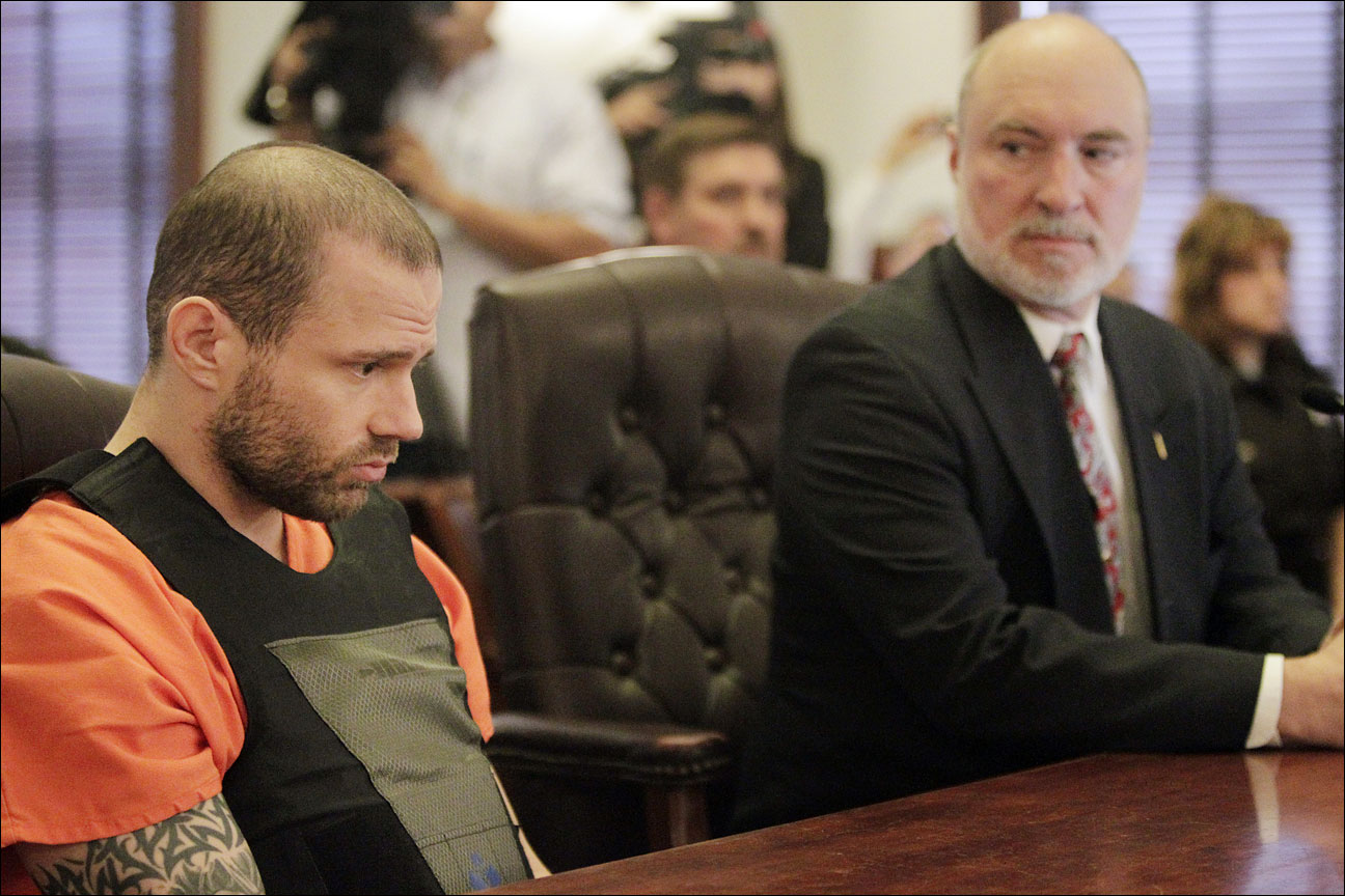 Jaren Kuester, left, appears in Lafayette County Court with attorney Guy Taylor, right, in Darlington, Wis., Friday afternoon, May 10, 2013. Jaren Kuester faces three counts of first-degree intentional homicide in the deaths of Gary Thoreson, his wife, Chloe Thoreson, and his brother, Dean Thoreson. Prosecutors say Kuester broke into Gary and Chloe Thoreson's Lafayette County farmhouse on April 27 and killed all three of them with a fireplace poker. (AP Photo/Wisconsin State Journal, M.P. King)