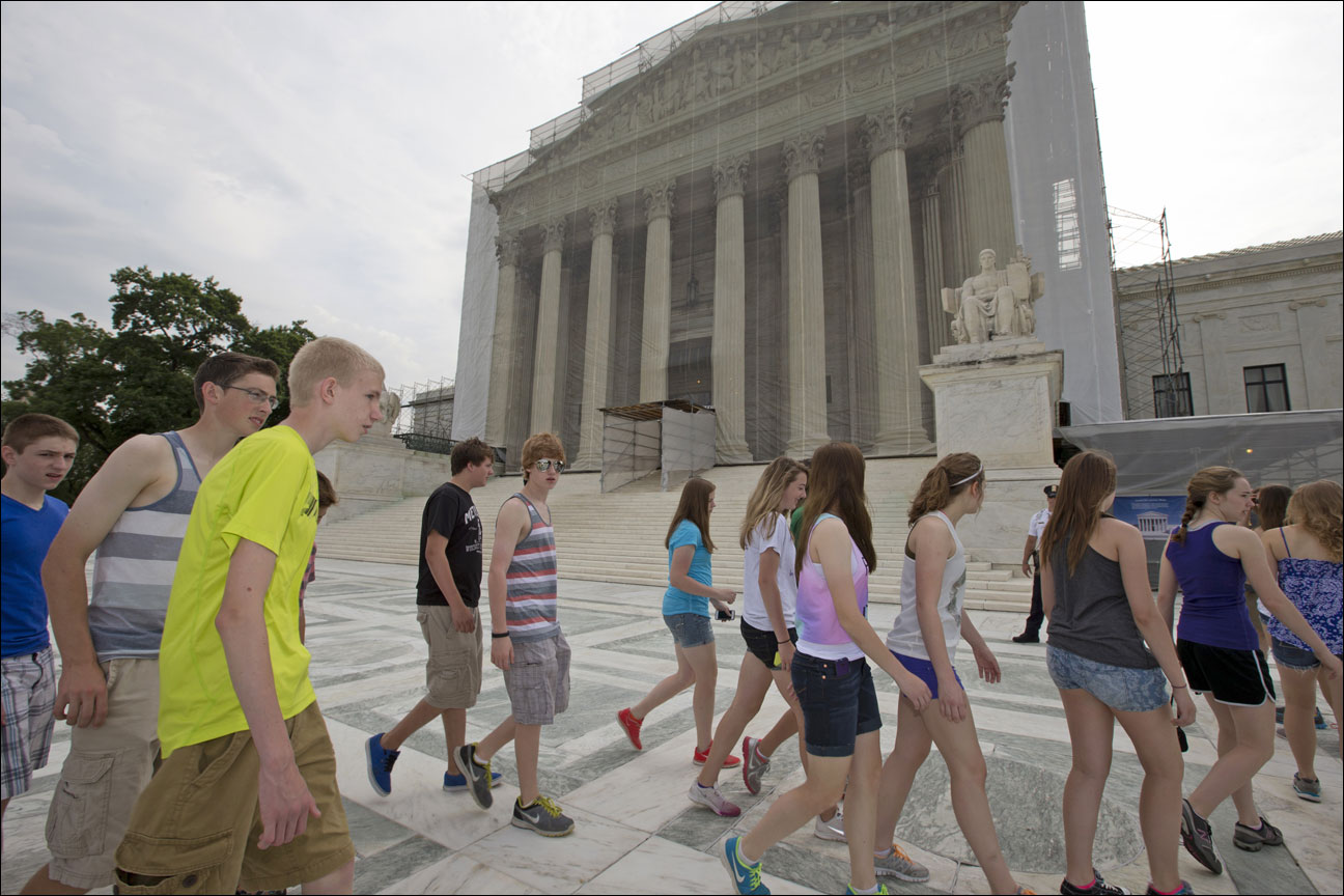 U.S. History students from Austin, Minn. High School visit the Supreme Court in Washington, Monday, June 17, 2013, in anticipation of key decisions being announced. With a week remaining in the current Supreme Court term, several major cases are still outstanding that could have widespread political impact on same-sex marriage, voting rights, and affirmative action. (AP Photo/J. Scott Applewhite)