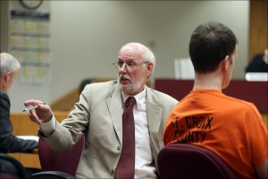 Attorney John Kucinski, left, turns to ask the Schaffhausen family if they were going to speak during the sentencing of his client, Aaron Schaffhausen, right, Monday, July 15, 2013, in Hudson, Wis. Schaffhausen, who killed his three daughters last year in an act of revenge against his ex-wife, was sentenced to life in prison with no chance of parole. (AP Photo/The Star Tribune, Elizabeth Flores)