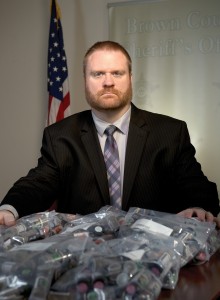 Poteat displays several bags of synthetic drugs that were seized during an investigation. 