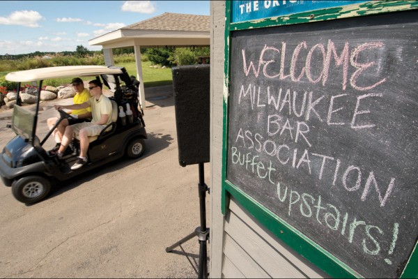 A sign welcoming members of the Milwaukee Bar Association greets passersby. About 125 people attended the event. (Staff photo by Kevin Harnack)