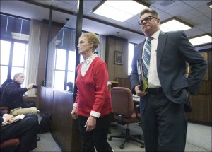 Ruby Klokow leaves Branch 3 court with attorney Kirk Obear on Monday following a hearing in which Klokow pleaded no contest to second-degree murder in the 1957 death of her infant daughter, Jeaneen, as part of a plea deal reached with prosecutors. (AP Photo/The Sheboygan Press/Gary C. Klein)