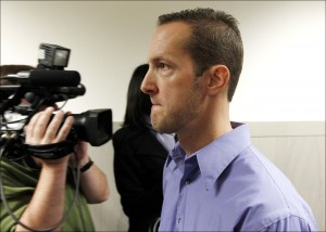 Milwaukee Police officer Jeffrey Dollhopf, one of four officers accused of illegally strip searching and sexually assaulting nearly a dozen people over a two-year span, exits after his initial court appearance in Milwaukee County Circuit Court on Oct. 9. (AP Photo/Milwaukee Journal-Sentinel, Mark Hoffman)