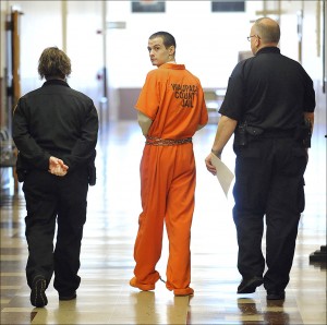Wood County corrections officers lead Gabriel Campos down a hallway in the Wood County Courthouse in Wisconsin Rapids,, Wis., Tuesday, Nov. 19, 2013, following his sentencing to life in prison with the possibility of parole in 40 years, in the killing of his former girlfriend Maisie E. McCullough. Campos was arrested at a Wisconsin Rapids motel with his 2-year-old son in September 2012, a day after his ex-girlfriend was found with her throat cut in the bathtub of a home the couple once shared. (AP Photo/The Daily Tribune, Casey Lake)