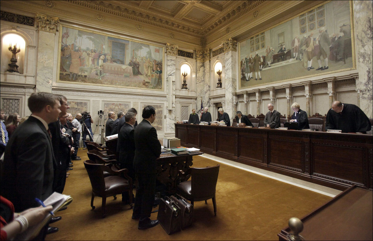 Members of the Wisconsin Supreme Court take their chairs at the beginning of arguments for Madison Teachers Inc. vs. Scott Walker, at the state Capitol in Madison, Wis., Monday, Nov. 11, 2013. The Wisconsin Supreme Court heard oral arguments Monday on whether Republican Gov. Scott Walker’s collective bargaining restrictions are unconstitutional as they apply to local public unions. (AP Photo/Wisconsin State Journal, M.P. King, Pool)