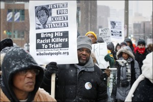 Protesters much during a rally demanding justice for Corey Stingley, outside of District Attorney John Chisholm's office in the Safety Building, in Milwaukee, Friday, Jan. 17, 2014. Stingley, 16, died in 2012 after being restrained by three men in a convenience store after being suspected of shoplifting alcohol. Milwaukee County district attorney John Chisholm conducted a yearlong investigation but said last week he wouldn't charge any of the three men with homicide or reckless conduct. (AP Photo/Milwaukee Journal-Sentinel, Gary Porter)