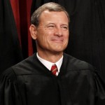 Chief Justice John Roberts is seen during the group portrait at the Supreme Court Building in Washington. Congress and the White House need to restore funding to the nation’s federal courts to keep from undermining “the public’s confidence in all three branches of government,” Roberts said Tuesday in his year-end report. Roberts has made similar calls for more money in the past. “I would like to choose a fresher topic, but duty calls. The budget remains the single most important issue facing the courts,” he said. (AP Photo/Pablo Martinez Monsivais, File)