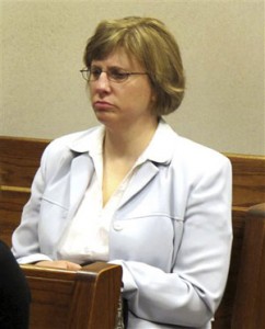 Kelly Rindfleisch sits in a Milwaukee County courtroom. A Wisconsin state appeals court on Wednesday, Feb. 19, 2014 released thousands of emails and other previously sealed documents collected during a criminal investigation into Rindfleisch, a former aide to Republican Gov. Scott Walker. (AP Photo/Dinesh Ramde, File)
