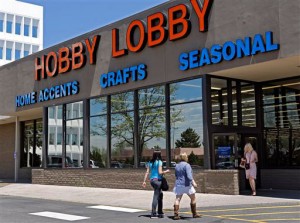 customers enter and exit a Hobby Lobby store in Denver. The Obama administration and its opponents are renewing the Supreme Court battle over President Barack Obama’s health care law in a case that pits the religious rights of employers against the rights of women to the birth control of their choice. Two years after the entire law survived the justices’ review by a single vote, the court is hearing arguments on Tuesday in a religion-based challenge from family-owned companies that object to covering certain contraceptives in their health plans as part of the law’s preventive care requirement. The largest company among them, Hobby Lobby Stores Inc. (AP Photo/Ed Andrieski, File)