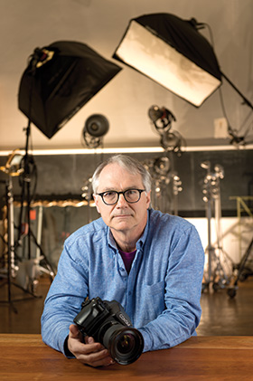 Photographer Eric Ferguson, who has been sued six times by members of a litigious trio, sits at his Spring Green studio. (Staff photos by Kevin Harnack)