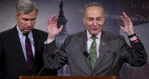 Sen. Charles Schumer (right), D-N.Y., and Sen. Sheldon Whitehouse, D-R.I., speak to reporters Wednesday on Capitol Hill about the Supreme Court's decision in the McCutcheon vs. FEC case. (AP Photo/Manuel Balce Ceneta)
