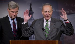 Sen. Charles Schumer (right), D-N.Y., and Sen. Sheldon Whitehouse, D-R.I., speak to reporters Wednesday on Capitol Hill about the Supreme Court's decision in the McCutcheon vs. FEC case. (AP Photo/Manuel Balce Ceneta)