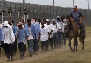  a prison guard on horseback watches inmates return from a farm work detail at the Louisiana State Penitentiary in Angola, La. As summer approaches, corrections officials throughout the country must deal with prisoners’ potentially fatal exposure to extreme heat. Advocates say rising temperatures are a threat to an increasingly mentally ill and aging prisoner population. Lawsuits over heat conditions in jails and prisons have been filed in Arizona, Wisconsin, Illinois, Louisiana, Georgia and Delaware. (AP Photo/Gerald Herbert, File)