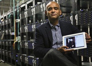Chet Kanojia, founder and CEO of Aereo, Inc., holding a tablet displaying his company's technology, in New York. The Supreme Court has ruled that a startup Internet company has to pay broadcasters when it takes television programs from the airwaves and allows subscribers to watch them on smartphones and other portable devices. The justices said Wednesday by a 6-3 vote that Aereo Inc. is violating the broadcasters' copyrights by taking the signals for free. The ruling preserves the ability of the television networks to collect huge fees from cable and satellite systems that transmit their programming. (AP Photo/Bebeto Matthews, File)