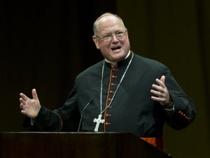 New York Cardinal Timothy Dolan speaks in Milwaukee following a document release that shed light on the Archdiocese of Milwaukee's handling of clergy abuse cases during a period that included his leadership. On Monday, June 2, 2014 federal judges in Milwaukee peppered attorneys with questions about how much the bankrupt Archdiocese spends to maintain its cemeteries and whether there is a strong interest in making maintenance funds available to compensate victims of clergy sexual abuse. Lawyers representing clergy sexual abuse victims want about $55 million in a cemetery trust fund, set up by Dolan, to be made available to compensate their clients. (AP Photo/Morry Gash, File)