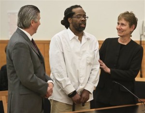Robert Hill, center, stands with his lawyers Harold Ferguson, left, and Sharon Katz, right, as Justice Neil Firetog declares Hill exonerated in Brooklyn Supreme Court, in the Brooklyn borough of New York. Prosecutors asked to throw out the decades-old convictions of three half-brothers who were investigated by homicide detective Louis Scarcella, whose tactics have come into question. The defendants, Hill, Alvena Jennette and Darryl Austin became the first people connected to the detective to be exonerated. (AP Photo/Bebeto Matthews, File)