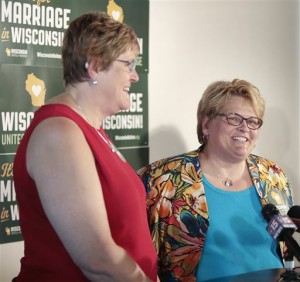 Katy Heyning, left, and Judi Trampf, right, plaintiffs in Wolf v. Walker, speak during a press conference at Plan B in Madison, Wis., Thursday, Sept. 4, 2014. Earlier in the day, the 7th Circuit Court of Appeals in Chicago struck down the gay marriage bans of Wisconsin and Indiana as unconstitutional. (AP Photo/Wisconsin State Journal, M.P. King)