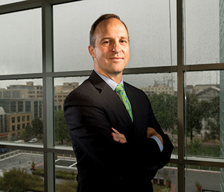 Patent attorney John Scheller stands at the Madison office of Michael Best & Friedrich LLP. (Staff photo by Kevin Harnack)