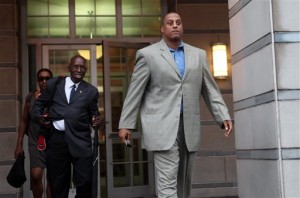 Tate George, former NBA basketball player and the CEO of purported real estate development firm The George Group, leaves federal court in Newark, N.J. George has been jailed since his conviction last fall on four mail fraud counts. His motion to be released on bail was denied by U.S. District Judge Mary Cooper on Wednesday, Oct. 29, 2014. (AP Photo/The Record of Bergen County, Leslie Barbaro, File)