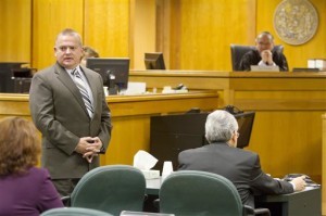 Rep. Bill Kramer, R- Town of Waukesha, standing left, apologizes to the woman he assaulted in 2011 during a sentencing hearing on Tuesday, Nov. 25, 2014 in Waukesha, Wis. Kramer, 49, was sentenced by Reserve Judge Neal Nettesheim to 5 months in jail and 3 years of probation after pleading no contest to fourth-degree sexual assault. He starts his sentence Dec. 4. (AP Photo/The Waukesha Freeman, Charles Auer)