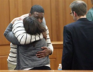 Mitrel Anderson hugs a member of his legal team, in La Crosse, Wis., County Circuit Court Thursday, Dec. 18, 2014 after being declared not guilty in fatal stabbing of DeMario Lee.(AP Photo/La Crosse Tribune, Rory O'Driscoll)