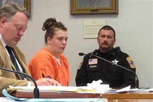 Amanda Butts, center, listens during a hearing Thursday, Dec. 11, 2014 in Trempealeau County Circuit Court in Whitehall, Wis. Butts been sentenced to 30 years in prison for giving a lethal overdose of a narcotic painkiller to a toddler, 22-month-old Alexis Behlke, in her care and physically abusing her. (AP Photo/The La Crosse Tribune, Chris Hubbuch)