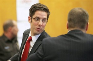 Defense attorney Anthony Cotton, left, speaks with Waukesha Asst. District Attorney Ted Szczupakiewicz after a hearing at the county court in Waukesha, Wis. on Thursday, Dec. 18, 2014 during the trial for two 12-year-old girls accused of stabbing another girl in May 2014. The two girls told detectives the attack was an attempt to please Slenderman, a fictional character they found on a horror website.