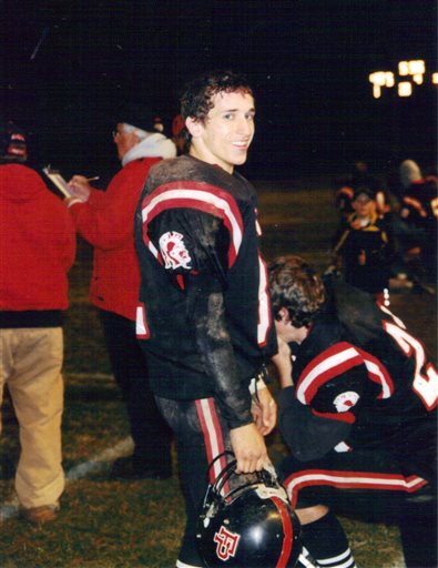 Joseph Chernach stands on the sideline during a high school football game in Crystal Falls, Mich. Pyka, the mother of Chernach, who died in 2012, is suing the Pop Warner organization, Thursday, Feb. 5, 2015, saying his suicide was the result of dementia and deep despair caused by brain injuries he suffered while playing youth football. (AP Photo/Debra Pyka)