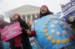 Margot Riphagen, of New Orleans, wears a birth control pills costume as she protests in front of the Supreme Court in Washington, as the court heard oral arguments in the challenges of President Barack Obama's health care law requirement that businesses provide their female employees with health insurance that includes access to contraceptives. Some insurance plans offered on the health marketplaces violate the law’s requirements for women’s health, according to a new report from a women’s legal advocacy group. The National Women’s Law Center analyzed plans in 15 states over two years and found some excluded dependents from maternity coverage, prohibited coverage of breast pumps or failed to cover all federally approved birth control methods. (AP Photo/Charles Dharapak, File)