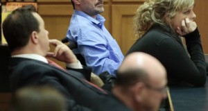 Andrew Steele, center, sits in court as jurors deliberate at the Dane County Courthouse in Madison, Wis., Wednesday, April 22, 2015. A jury on Thursday, April 23, 2015, found Steele, 40, a former Wisconsin sheriff's deputy with Lou Gehrig's disease, not legally responsible in the killing of his wife and sister-in-law. Steele showed little emotion as a judge in Dane County read the verdict early Thursday after a jury deliberated for about 10 hours through the night. (M.P. King/Wisconsin State Journal via AP)