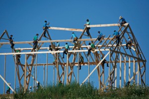 A group of Amish men build a barn in 2008 in Westby, Wis. (AP Photo/Milwaukee Journal-Sentinel, Jeffrey Phelps)