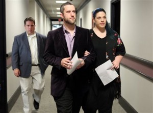 Actor Dustin Diamond enters court at Ozaukee County Justice Center with his fiance, Amanda Schutz, Thursday, June 25, 2015, in Port Washington, Wis. Diamond, who played Screech on the 1990s TV show "Saved by the Bell," was sentenced to four months in jail for a barroom stabbing on Christmas Day. (Mike De Sisti/Milwaukee Journal-Sentinel via AP)