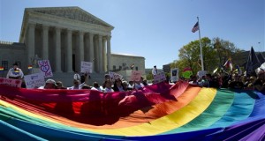 demonstrators stand in front of a rainbow flag of the Supreme Court in Washington, as the court was set to hear historic arguments in cases that could make same-sex marriage the law of the land. Gay and lesbian couples could face legal chaos if the Supreme Court rules against same-sex marriage in the next few weeks. Same-sex weddings could come to a halt in many states, depending on a confusing mix of lower-court decisions and the sometimes-contradictory views of state and local officials. Among the 36 states in which same-sex couples can now marry are 20 in which federal judges invoked the Constitution to strike down marriage bans. (AP Photo/Jose Luis Magana, File)